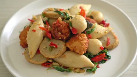 spicy stir fried fish balls with herbs