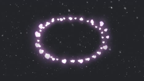 animation of heart frame over snow falling