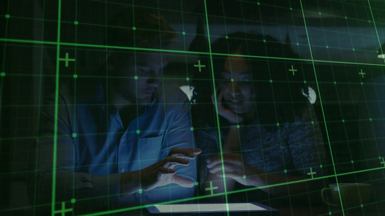 Man reaching tablet, tapping and pointing, woman watching, tapping, both exploring under green grid