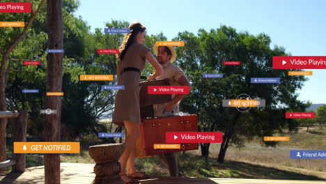 social media notifications animation over couple greeting each other outdoors