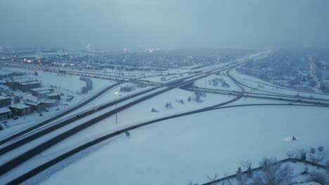 cats driving down busy freeway traffic during a misty winter evening