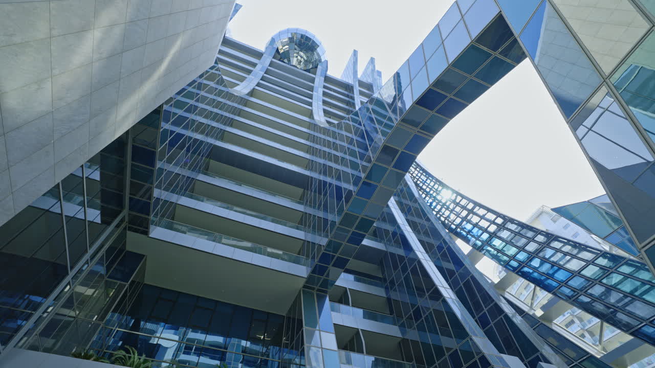 Modern Glass Skyscraper Building Exterior with Sun Flare