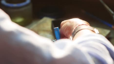 Craftswoman-working-in-workshop