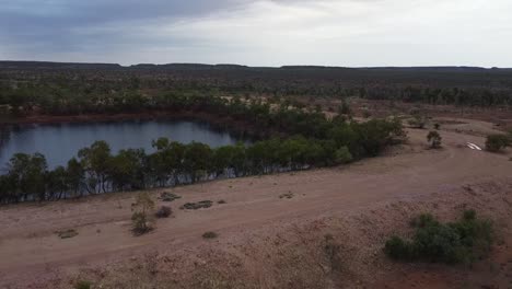 Aerial-Shot-of-an-Abandoned-Mine-Filled-With-Water-in-the-Outback