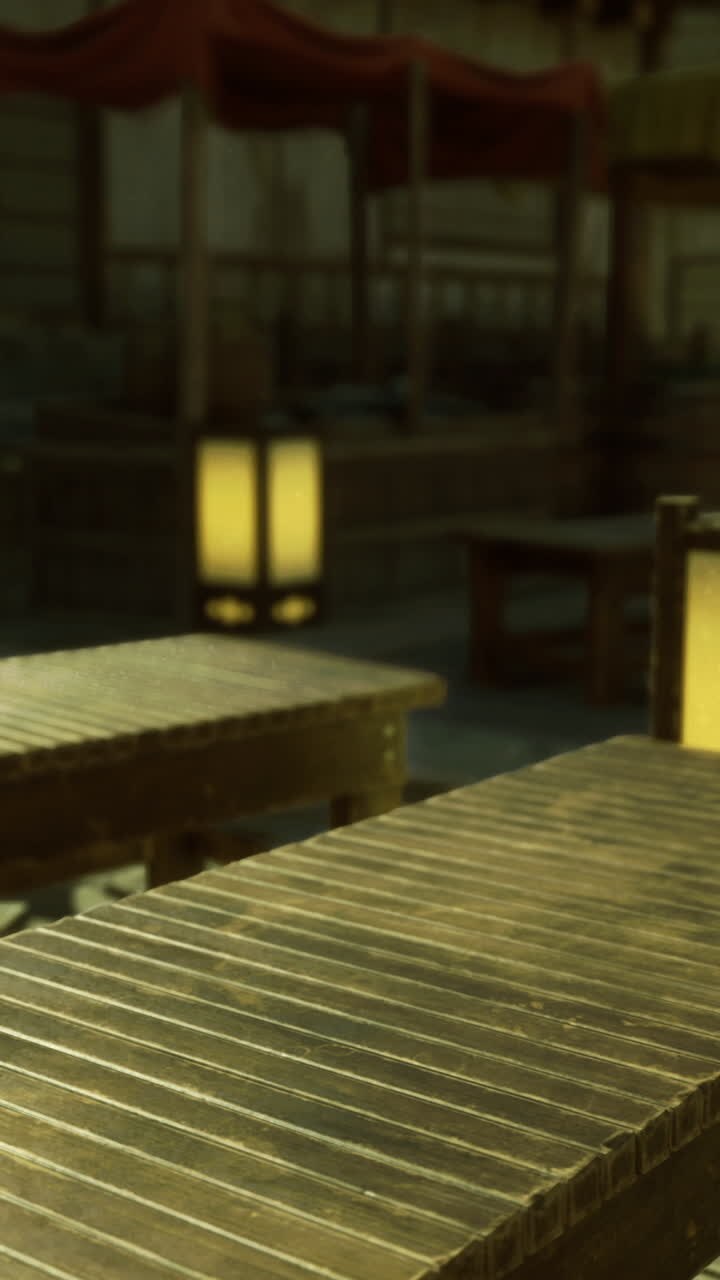 Tranquil outdoor dining area featuring wooden tables and soft lighting