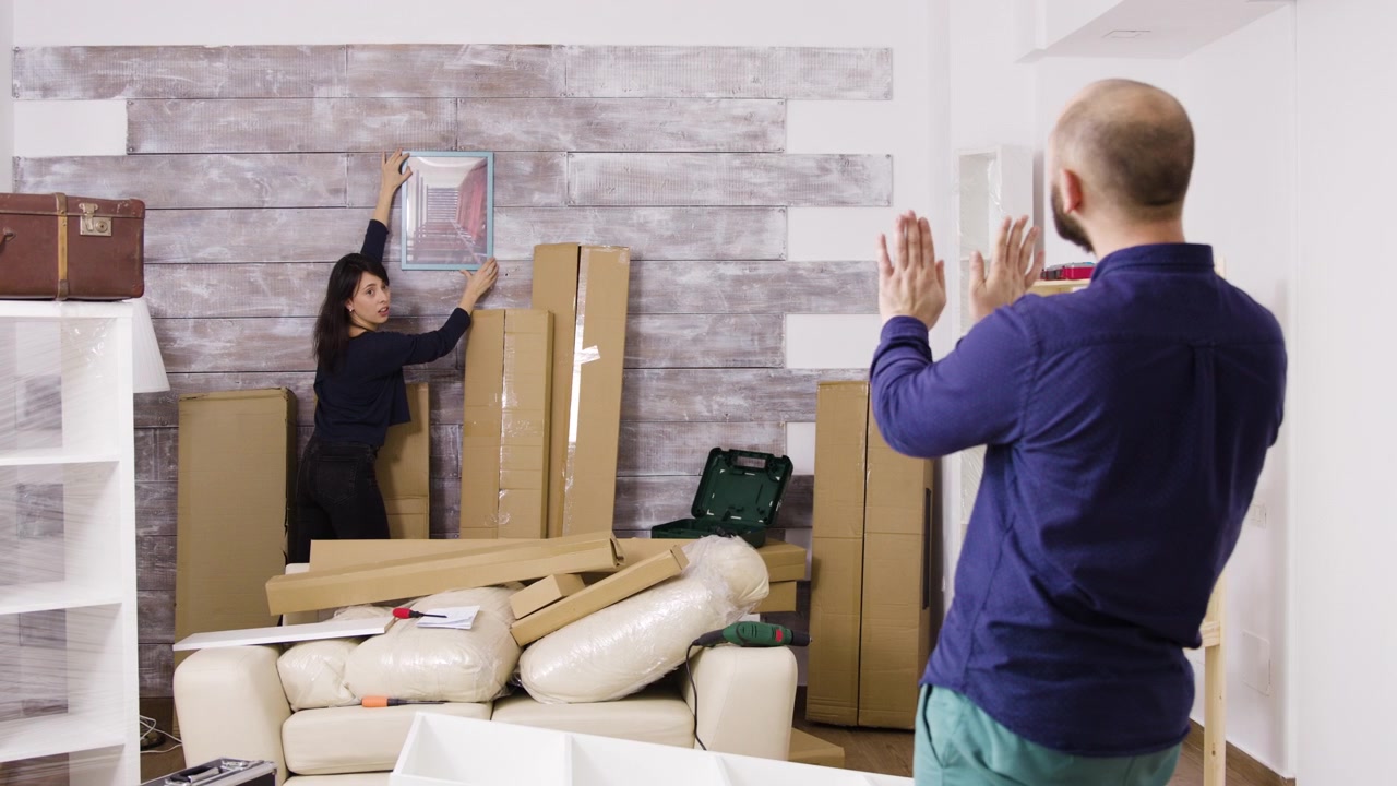 Couple Decorating Their New Home Together
