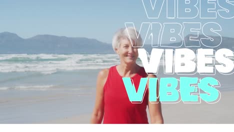 Animation-of-text-vibes,-in-white-and-blue,-with-happy-senior-woman-on-beach