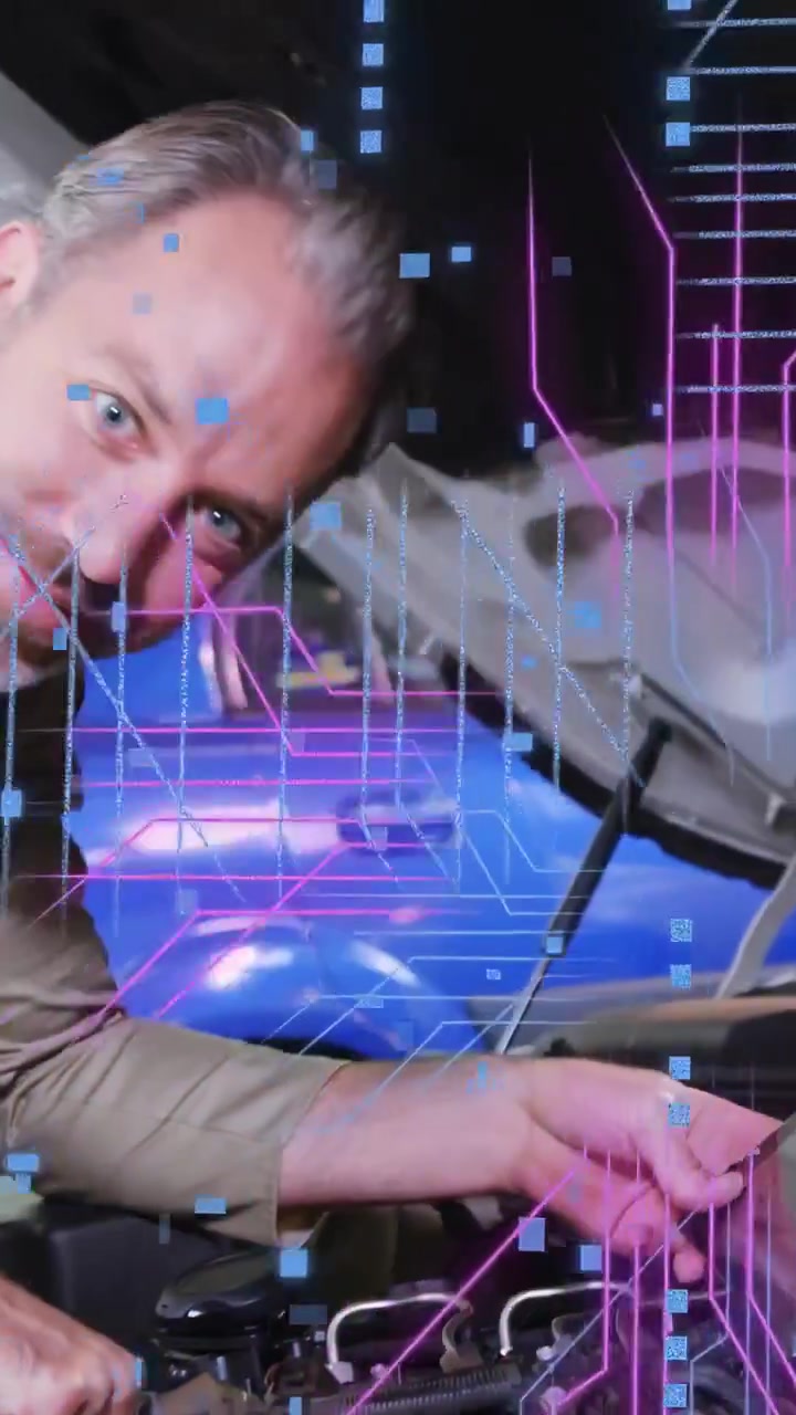 Vertical video: Auto tech with hood raised, diagnosing engine while neon overlays tracking hands