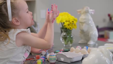 happy easter. mother and child with bunny ears preparing for the holiday. painting eggs