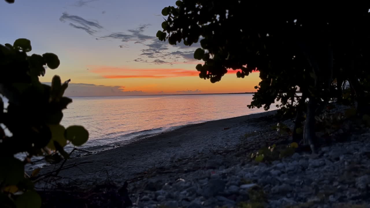 Pebble rock beach sunset view from Cuba
