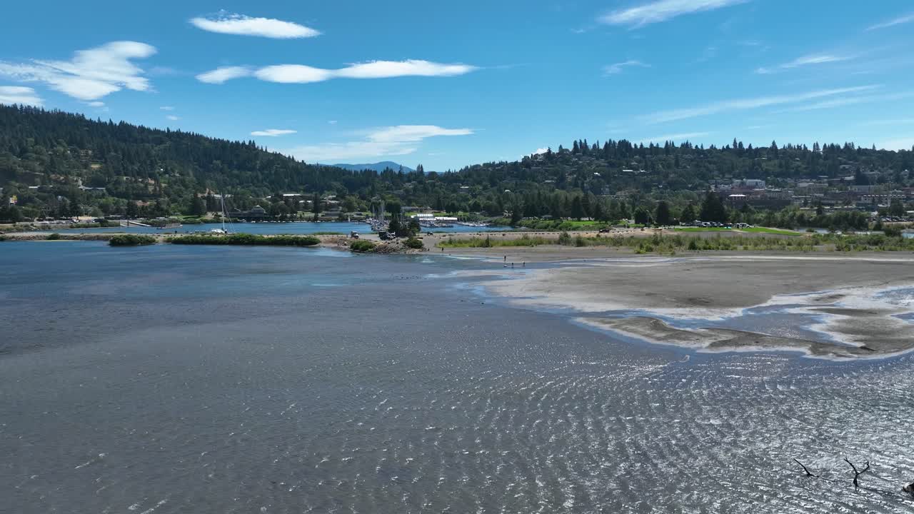 Aerial view rising over the Hood river toward the town, summer in Oregon, USA