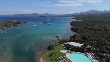 sardinia cala di volpe on costa esmeralda drone revealing stunning sea view resort with swimming pool
