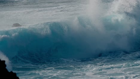Dramatic ocean waves collide with the volcanic coastline near Timanfaya National Park, located on the island of Lanzarote in the Canary Islands, Spain.