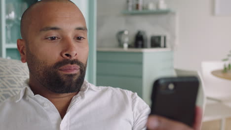 hearing impaired man having video chat on smartphone using sign language waving enjoying communication chatting on mobile phone