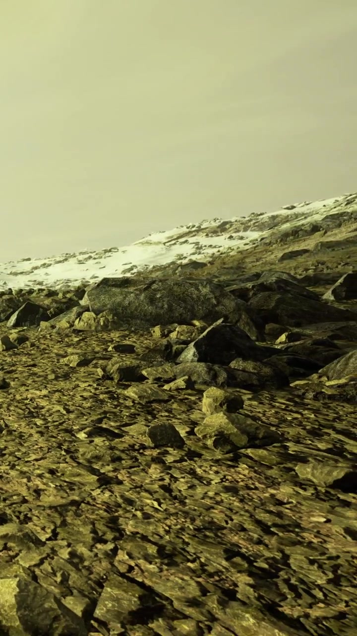 Rocky landscape with snow on mountain under cloudy sky in winter time