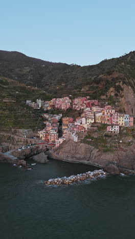 colorful houses on cliffs with the sea below, captured during a peaceful moment in manarola