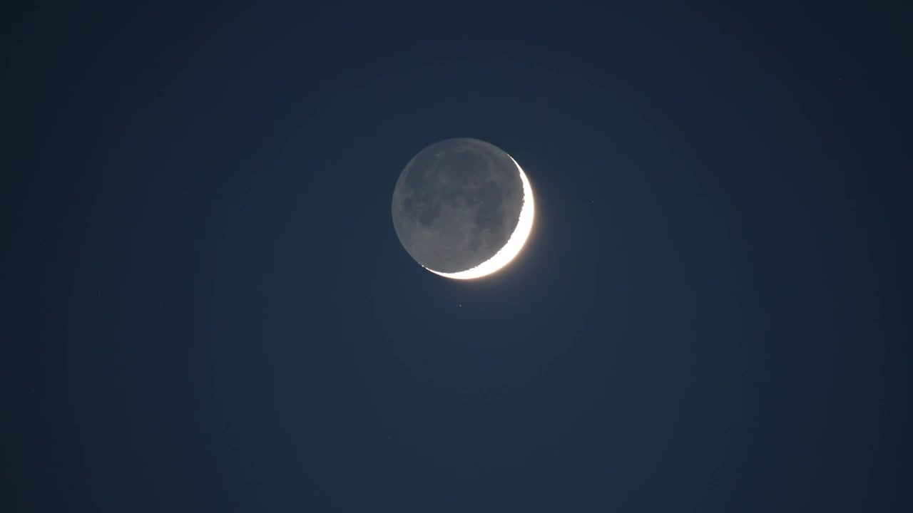 Crescent Moon Moving Across the Night Sky