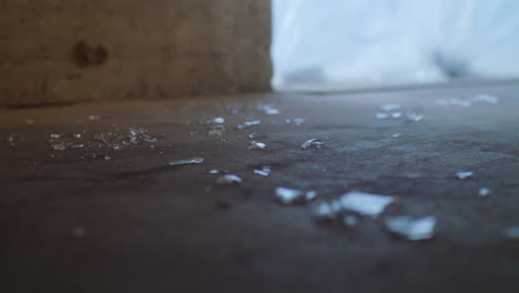 Broken-Glass-on-concrete-floor-dramatic-lighting