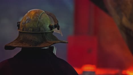 worker in protective gear at a metal foundry