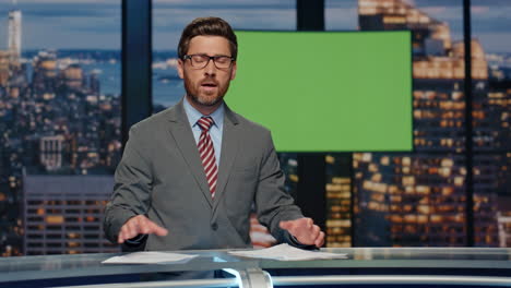 evening news journalist broadcasting at greenscreen monitor tv studio closeup
