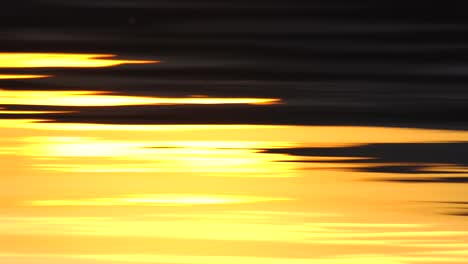 Reflection-of-sunset-over-lake-surface