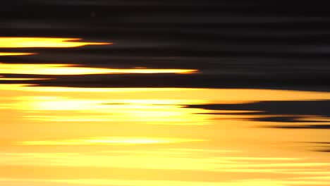 reflection of sunset over lake surface