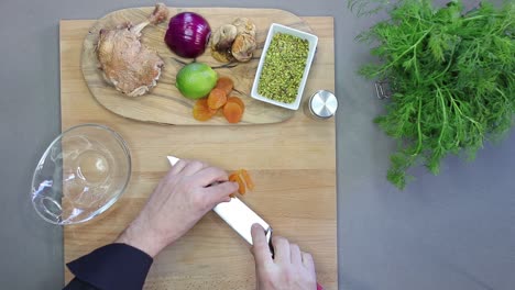 cutting fruits for cooking cenital view kitchen