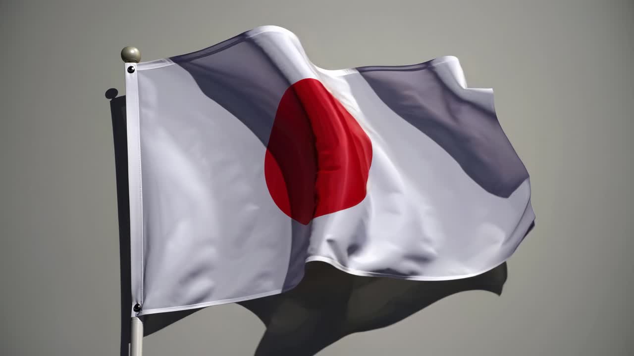 Video of a Japanese flag waving against a neutral background