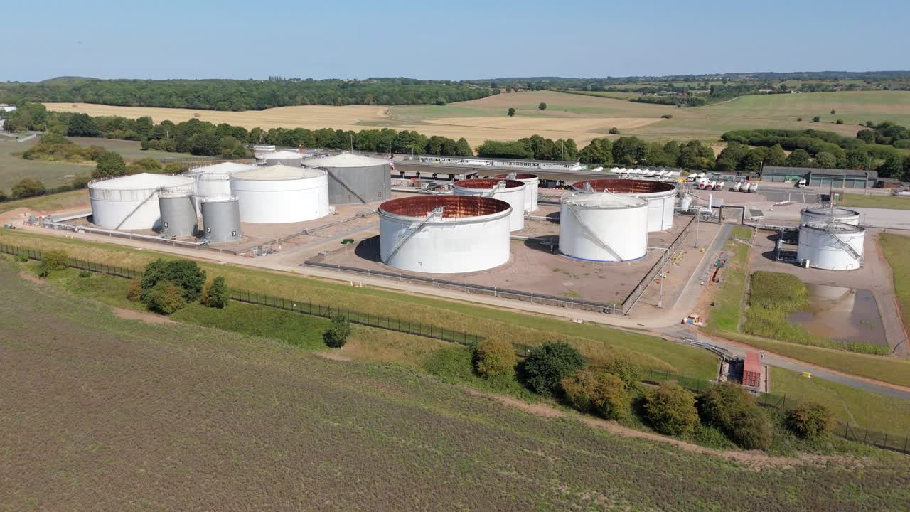 Kingsbury England UK aerial drone footage of energy distribution site with fuel silos, chemical plant, petroleum gas and diesel storage industry