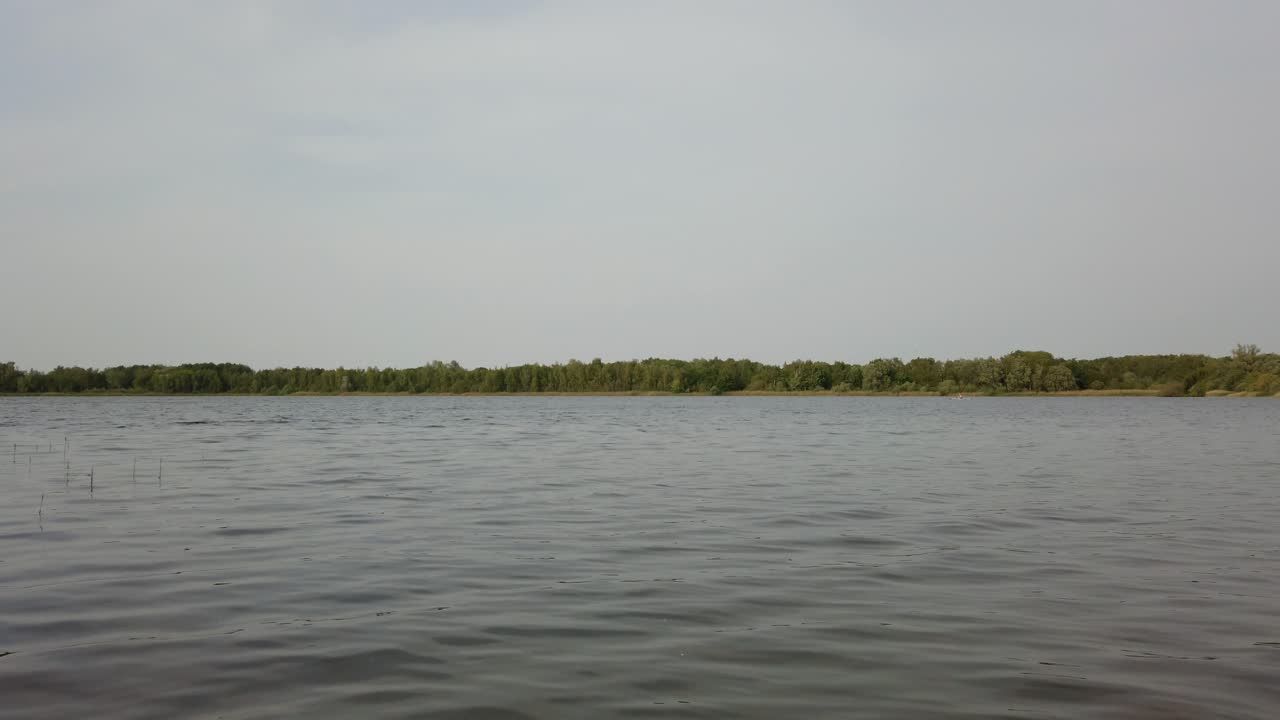 A calm water wave at the lake steady shot