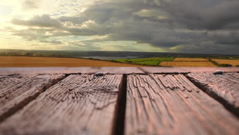 wooden deck with a view of wide open fields