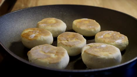 homemade wheat buns baking in a frying pan in a time-lapse