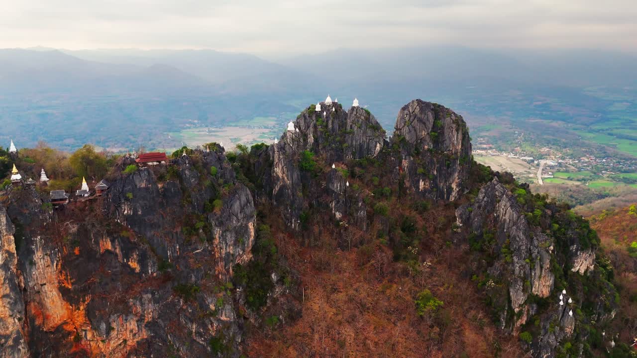 aerial drone sky temple in Lampang Thailand mountaintop pagodas of Wat Chaloem Phra Kiat
