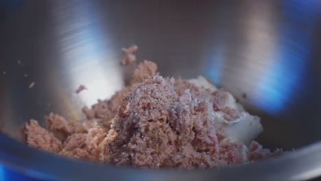 canned tuna, low-fat cheese, and mayonnaise in a mixing bowl, seasoned with salt, pepper, and olive oil