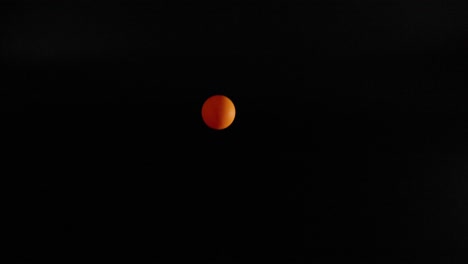 orange ball bouncing against a dark background