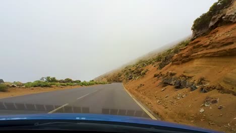 Scenic-Drive-In-Teide-National-Park-On-A-Foggy-Day,-Desert-Landscape,-Driver-POV,-Canary-Islands,-Tenerife,-Spain