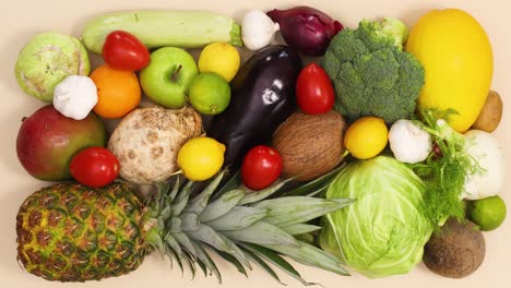 fresh ripe and organic fruits and vegetables appear and filling the background. stop motion flat lay