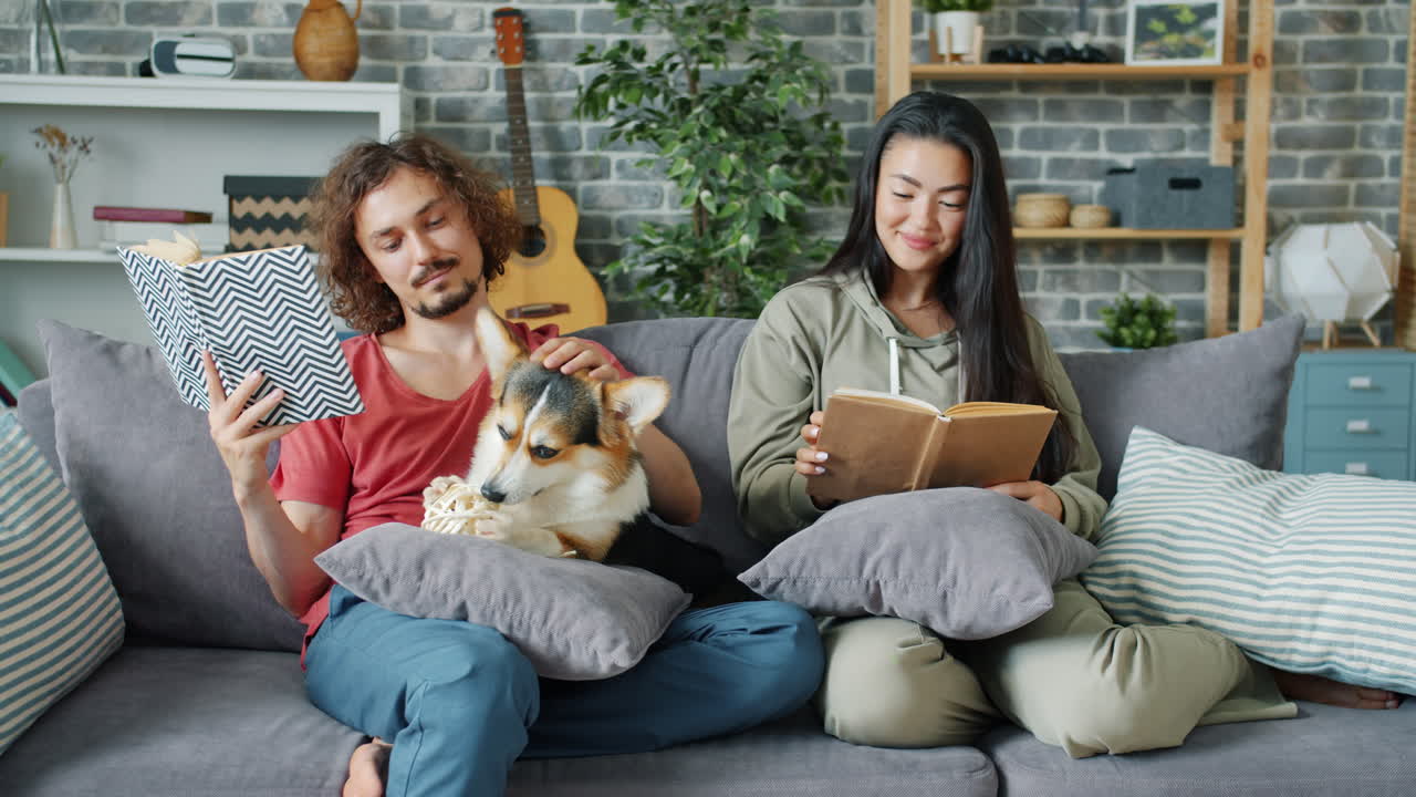 Couple Reading with a Dog on the Couch