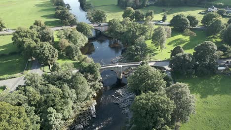 An-aerial-view-of-the-Devil's-Bridge-at-Kirkby-Lonsdale-on-a-summer-evening,-Yorkshire,-England,-UK