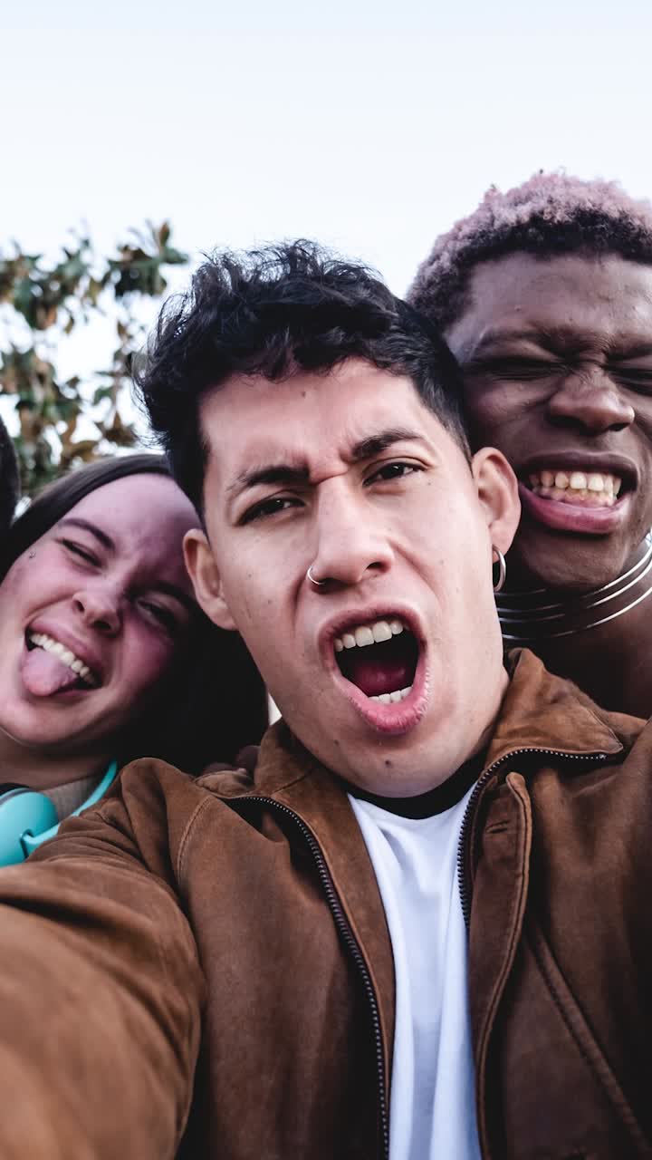 Happy diverse friends taking selfie. Stop motion video