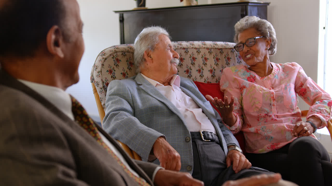 Group of Mixed race senior friends interacting with each other at nursing home 4k