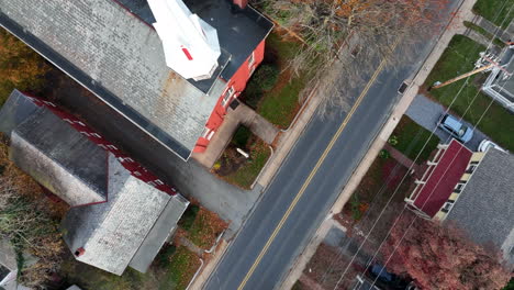 Top-down-aerial-of-church-steeple-in-American-village