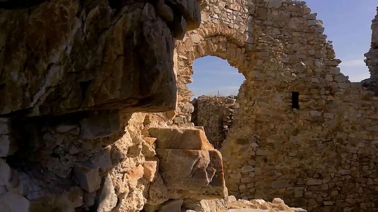 Stone walls of old ruins on a sunny day,  PAN RIGHT