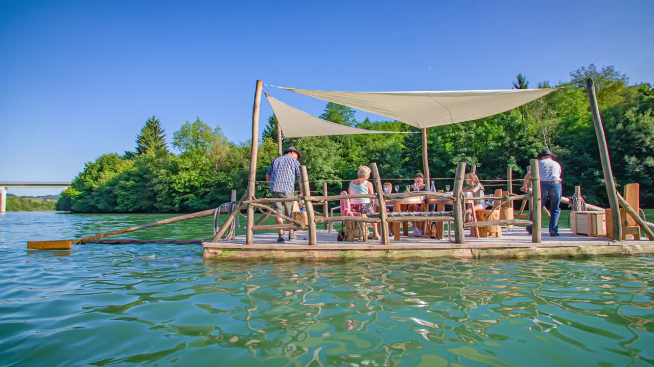 Caucasian family enjoys raft picnic adventure on the Drava river,Muta, Slovenia