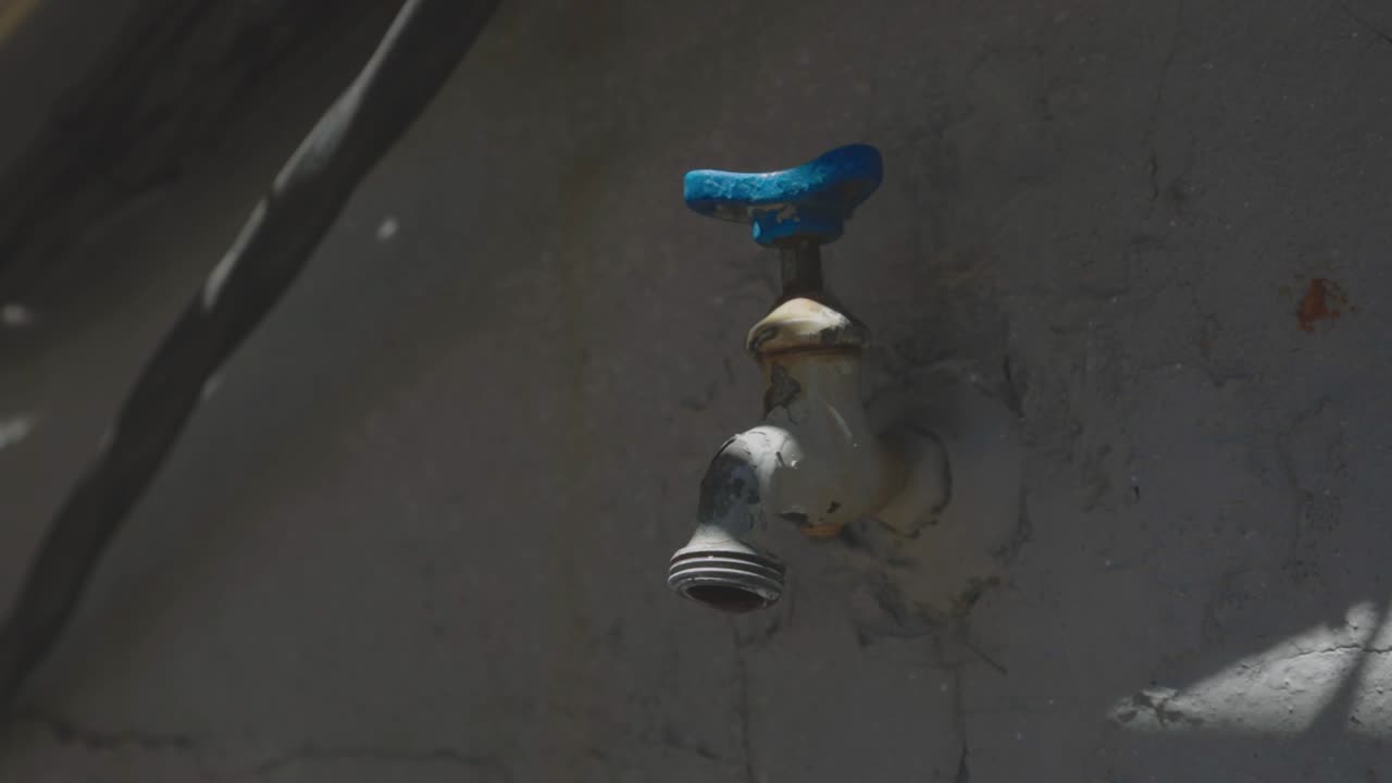 Water Leaking From The Tap - Closeup Shot