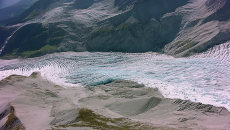 aerial view of a vast glacier in a mountain valley