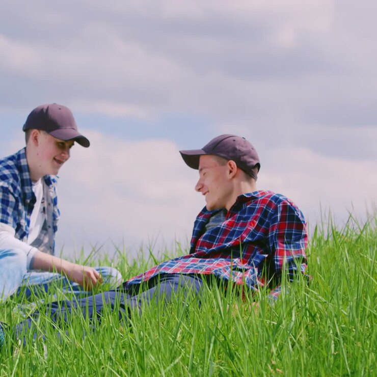 Two Brothers Rest On A Green Hill