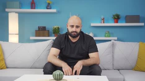 unhappy man living poor.