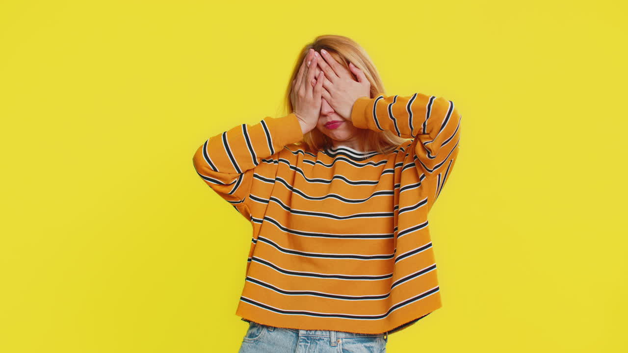 Afraid shocked woman closing eyes confused shy scared reject to watch phobia shame stress