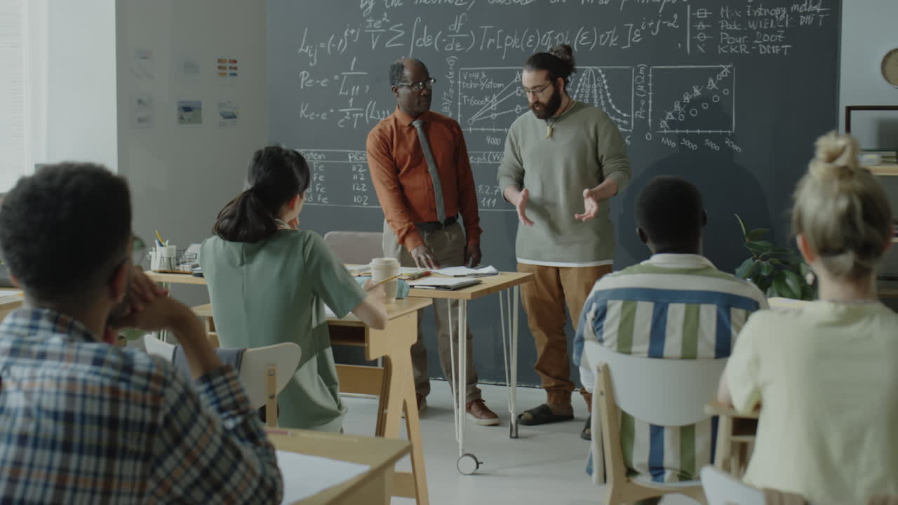 A classroom scene with instructors giving a lecture to students